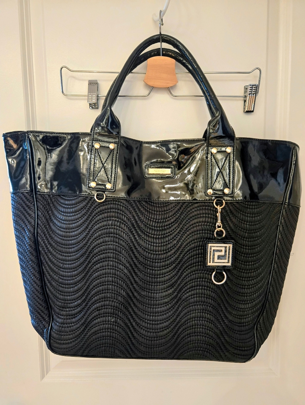 Black Quilted Tote with Glossy Trim and Pendant Charm